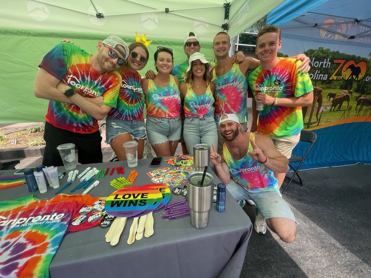 Loan Pronto employees at the Loan Pronto booth for the 2022 Charlotte Pride Festival and Parade. 